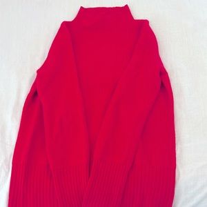 Bright pink turtle neck sweater